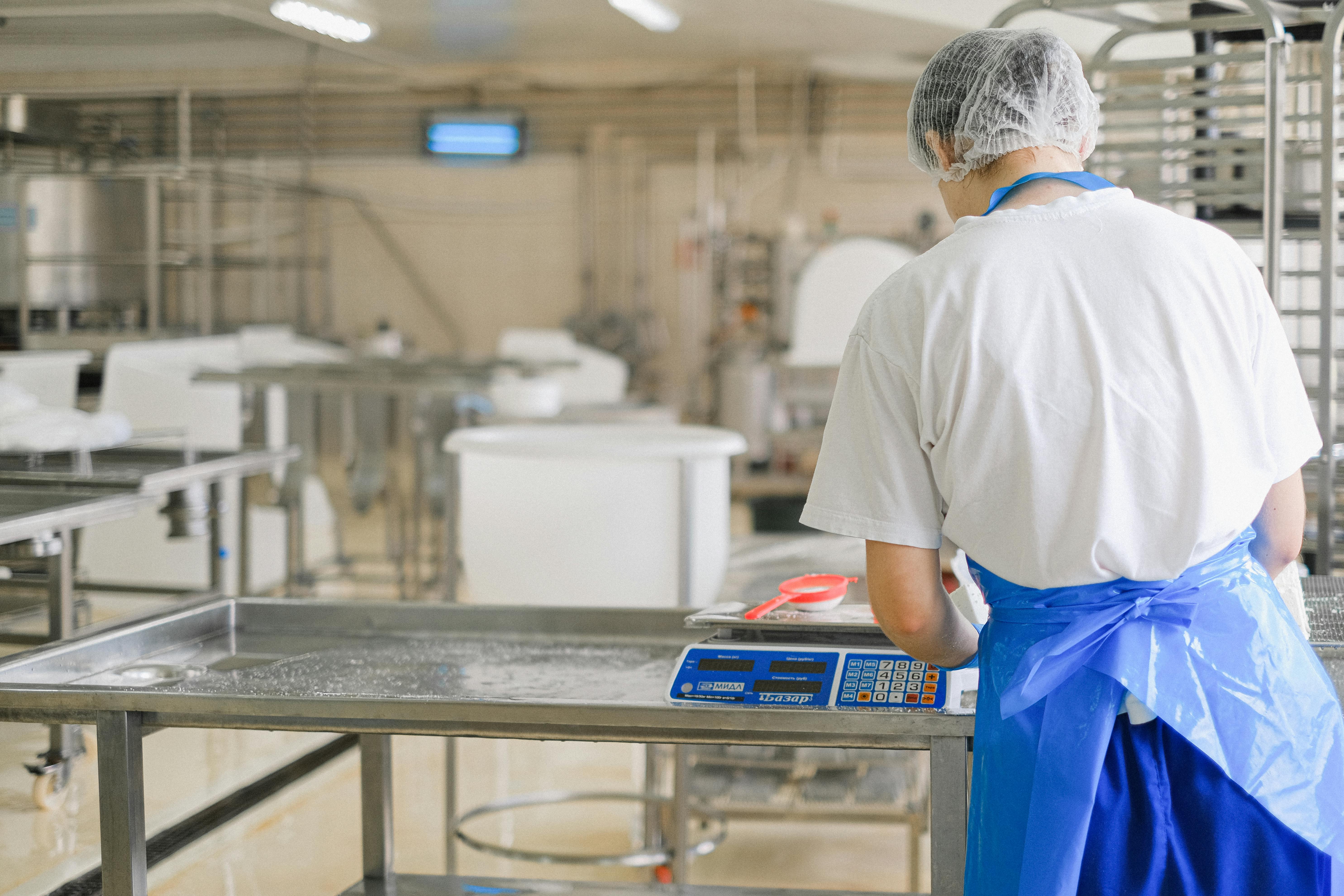Person working in a dairy quality control lab